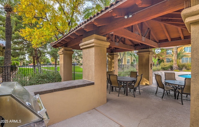 view of patio / terrace with a gazebo, a grill, and exterior kitchen