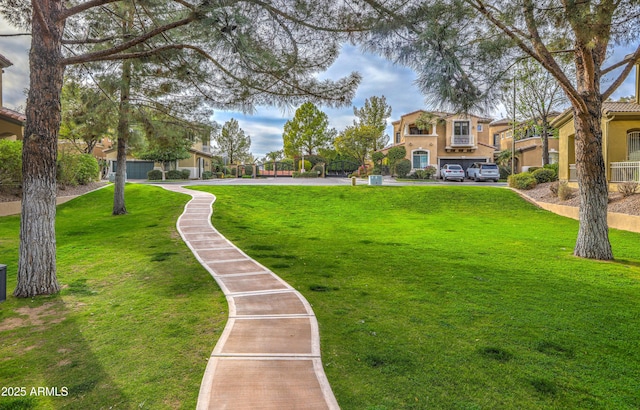 view of property's community with a lawn