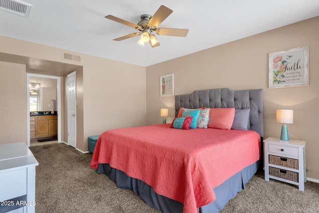 bedroom featuring carpet flooring, baseboards, ensuite bathroom, and ceiling fan