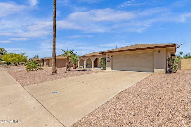 view of front of home featuring stucco siding, an attached garage, and concrete driveway