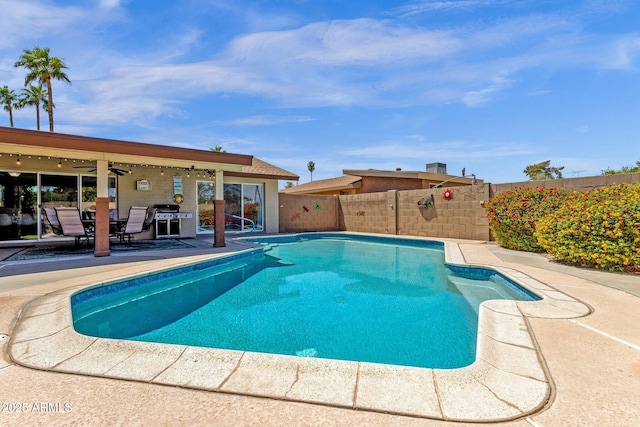 view of pool featuring a patio, a fenced backyard, and a ceiling fan