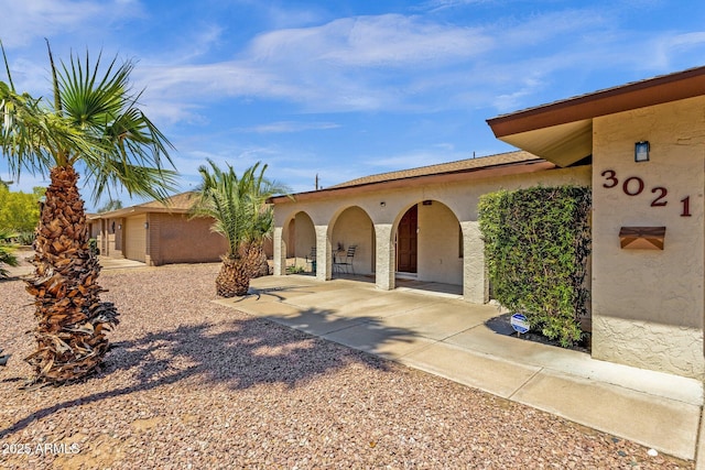 mediterranean / spanish house with stucco siding
