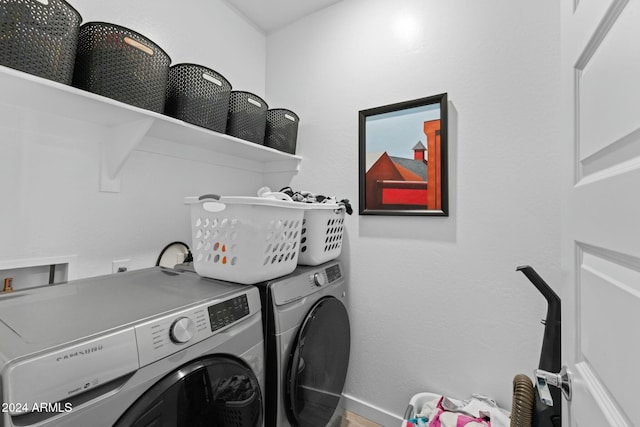 laundry room with washing machine and clothes dryer