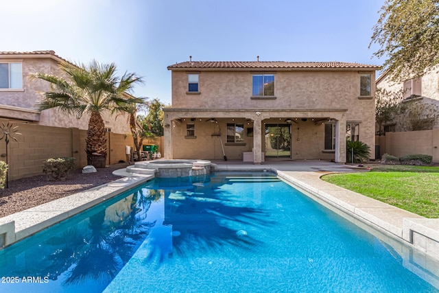 view of swimming pool featuring an in ground hot tub and a patio area