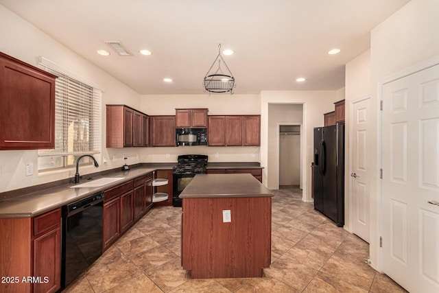 kitchen with a center island, sink, and black appliances