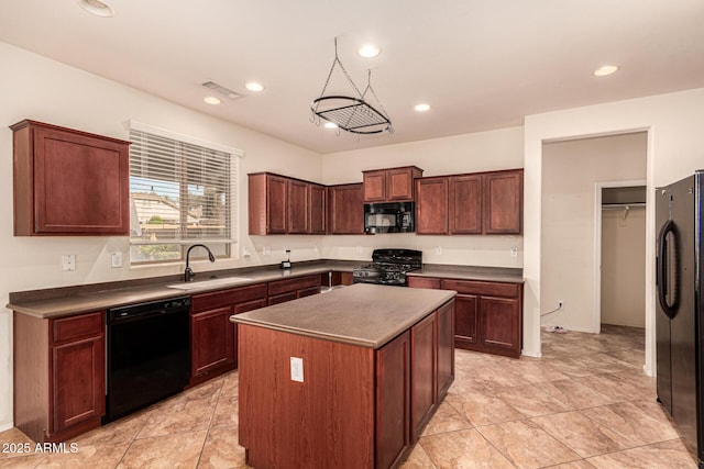 kitchen featuring a center island, sink, and black appliances