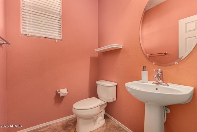 bathroom with tile patterned floors and toilet