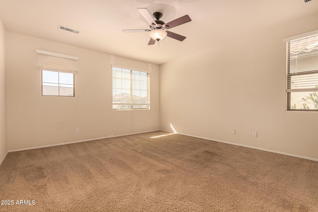 unfurnished room featuring carpet and ceiling fan