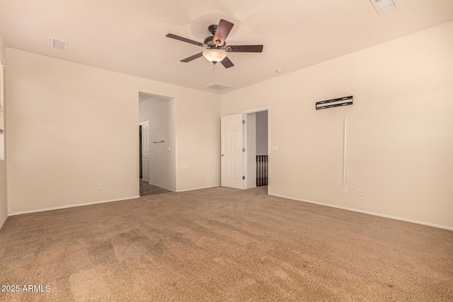 unfurnished room with carpet flooring and ceiling fan