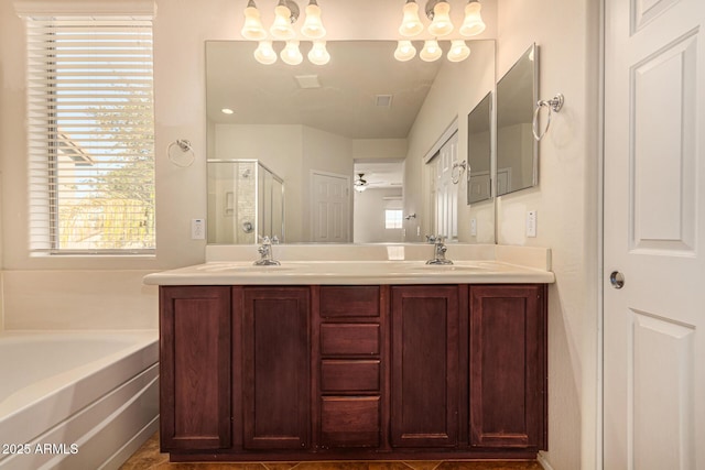 bathroom with shower with separate bathtub, vanity, and ceiling fan