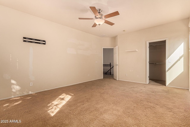 unfurnished bedroom with light colored carpet, a closet, and ceiling fan