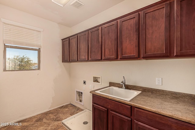 clothes washing area featuring cabinets, sink, hookup for an electric dryer, and hookup for a washing machine