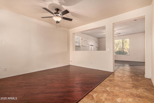 spare room featuring hardwood / wood-style floors and ceiling fan