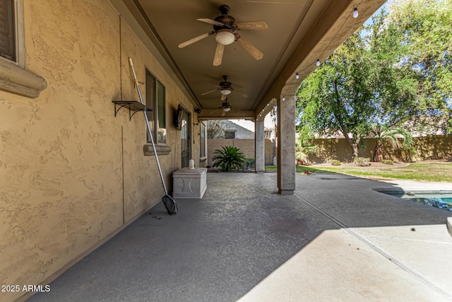 view of patio featuring ceiling fan