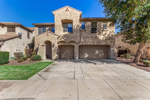 mediterranean / spanish home featuring a garage