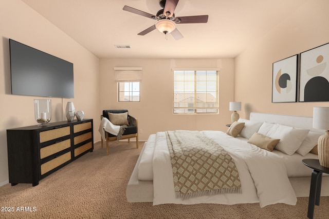 bedroom featuring ceiling fan and light carpet