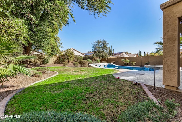 view of yard featuring a fenced in pool and a patio area