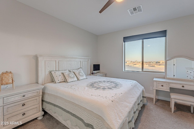 bedroom with ceiling fan and light colored carpet