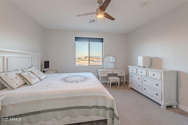 bedroom with ceiling fan and light colored carpet