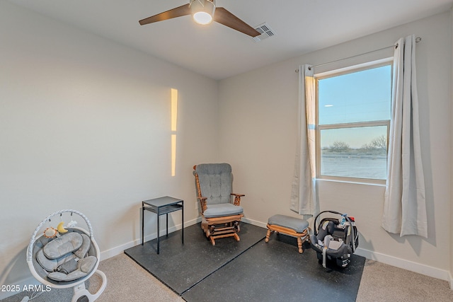 sitting room with ceiling fan