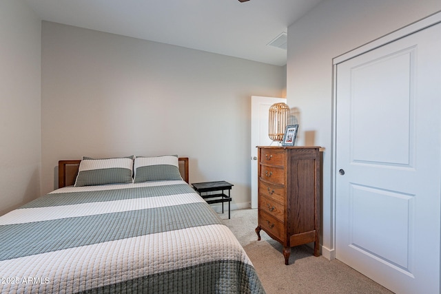 bedroom featuring light colored carpet