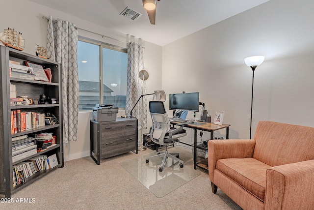 office with ceiling fan and light carpet