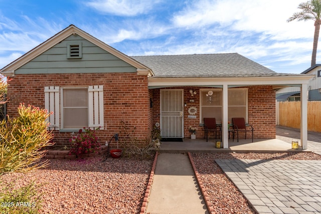 view of front of property featuring covered porch