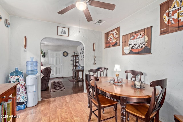 dining space featuring light hardwood / wood-style floors and ceiling fan