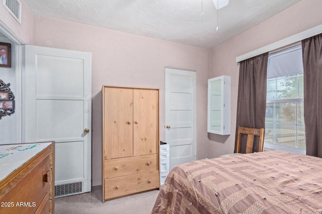 bedroom with light colored carpet