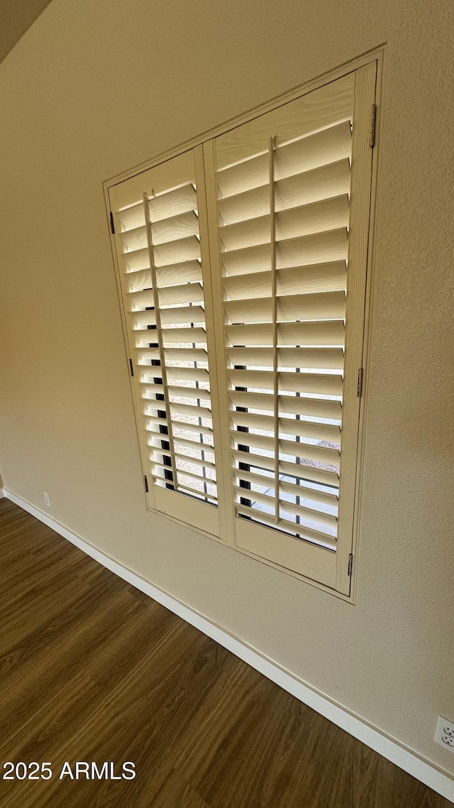 interior details featuring hardwood / wood-style flooring