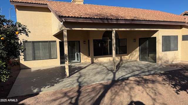 back of house with a patio area