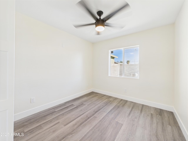 1917 E Monroe St, Phoenix, AZ 85034 - unfurnished room with light wood-style floors, ceiling fan, and baseboards