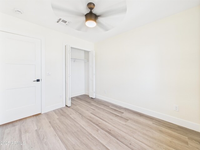 1917 E Monroe St, Phoenix, AZ 85034 - unfurnished bedroom with light wood-style flooring, baseboards, a closet, and a ceiling fan