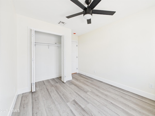 1917 E Monroe St, Phoenix, AZ 85034 - unfurnished bedroom featuring light wood-style floors, a closet, baseboards, and ceiling fan