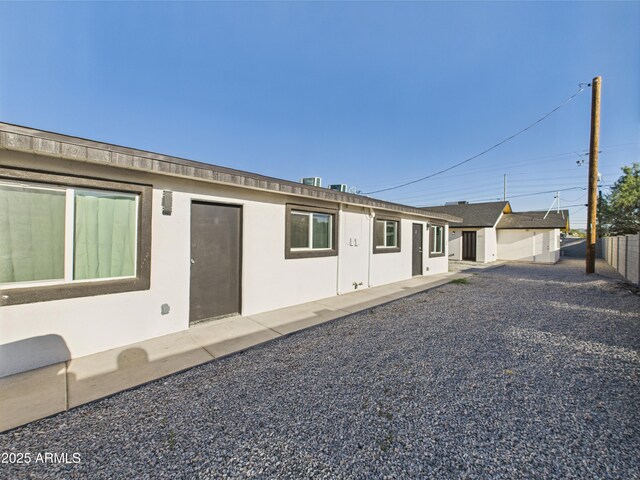 1917 E Monroe St, Phoenix, AZ 85034 - rear view of house featuring stucco siding