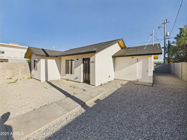 1917 E Monroe St, Phoenix, AZ 85034 - rear view of house with stucco siding and a fenced backyard