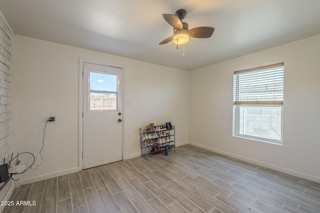 interior space with plenty of natural light and ceiling fan