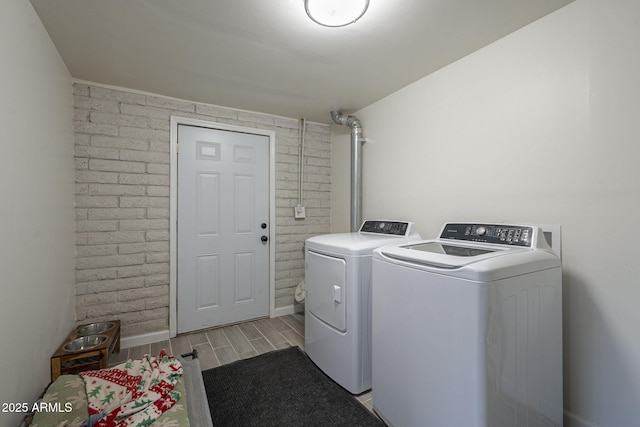 washroom with separate washer and dryer