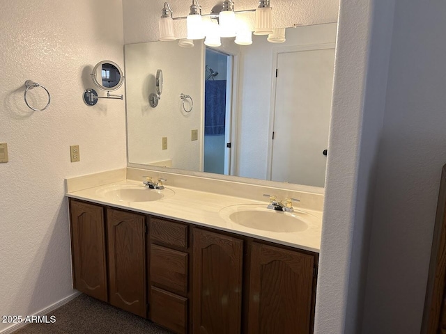 8981 W Tuckey Ln, Glendale, AZ 85305 - full bathroom with double vanity, a textured wall, and a shower