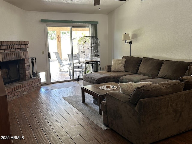 8981 W Tuckey Ln, Glendale, AZ 85305 - living room featuring wood finished floors, ceiling fan, and a brick fireplace