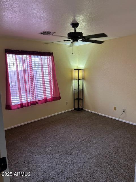 8981 W Tuckey Ln, Glendale, AZ 85305 - carpeted spare room featuring a ceiling fan, a textured ceiling, and baseboards