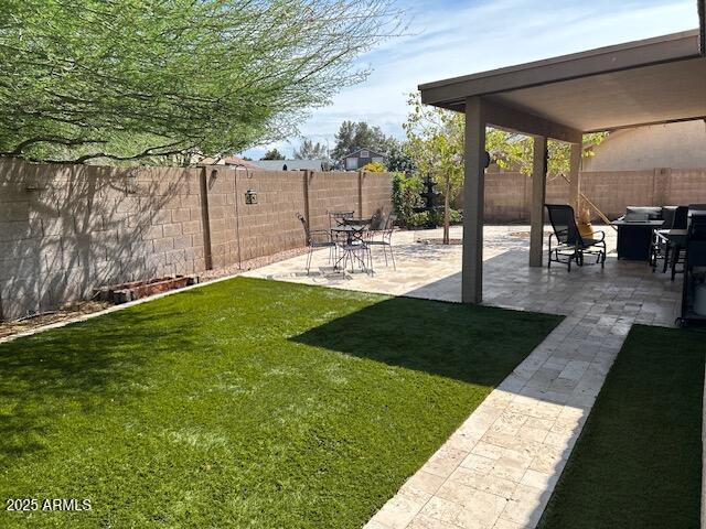8981 W Tuckey Ln, Glendale, AZ 85305 - view of yard with a patio
