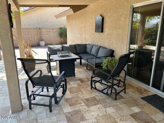 8981 W Tuckey Ln, Glendale, AZ 85305 - view of patio featuring an outdoor living space with a fire pit and fence