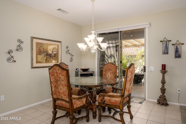 dining room featuring an inviting chandelier, baseboards, light tile patterned floors, and visible vents