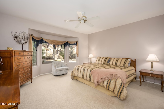 bedroom featuring carpet floors, baseboards, and a ceiling fan