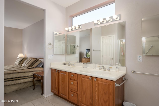 bathroom with double vanity, a sink, and tile patterned floors