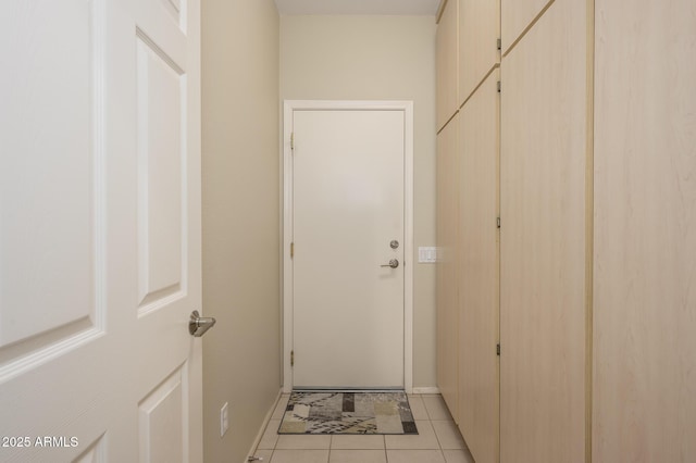 doorway to outside featuring light tile patterned floors