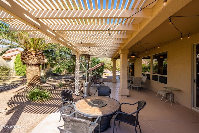 view of patio featuring outdoor dining area and a pergola