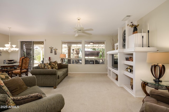 living area with light carpet, visible vents, baseboards, and ceiling fan with notable chandelier