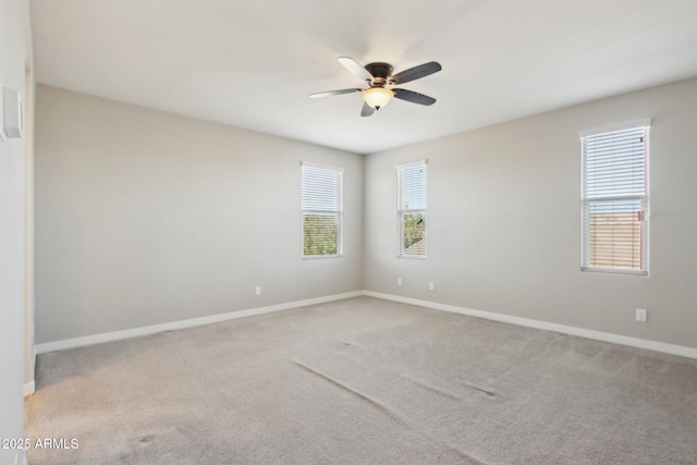 empty room with light carpet and ceiling fan